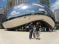 Dad, Little Mom amd Scott at The Bean. The Bean is covered by Stainless steel plates over a fortified steel frame.  Under these plates, it is actually hollow on the inside.  It was built in place because it was too heavy, bulky and dangerous to transport into Downtown Chicago.  Also, after it was built, it had to be polished and have its seams removed, giving the appearance of being one large shiney object, instead of being the sum of many shiny stainless steel plates.